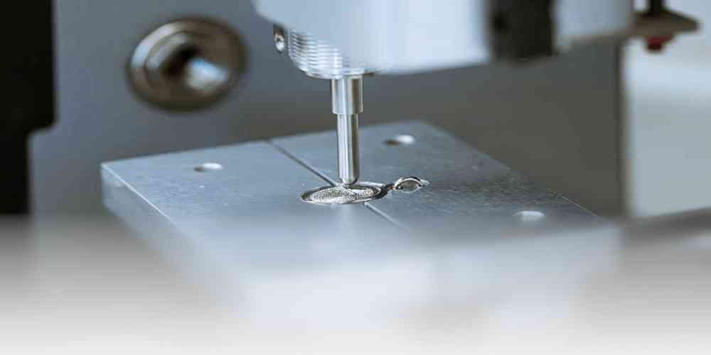 Eternity's Touch jewelry being engraved with a fingerprint
