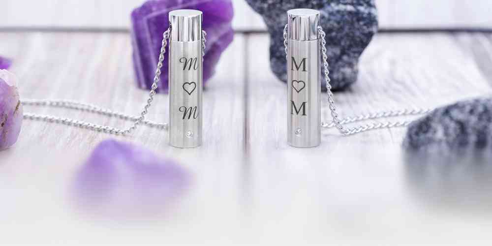 Two Simply Remembered Cylinder Keepsakes, each with a different font engraved